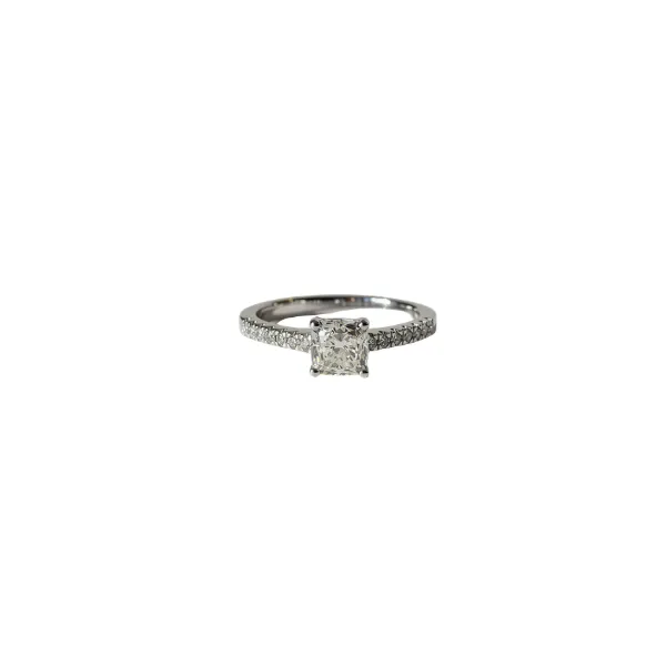 Solitario a 4 griffe in oro bianco 18 kt con diamante 1,00 ct e diamanti sul gambo 0,14 ct